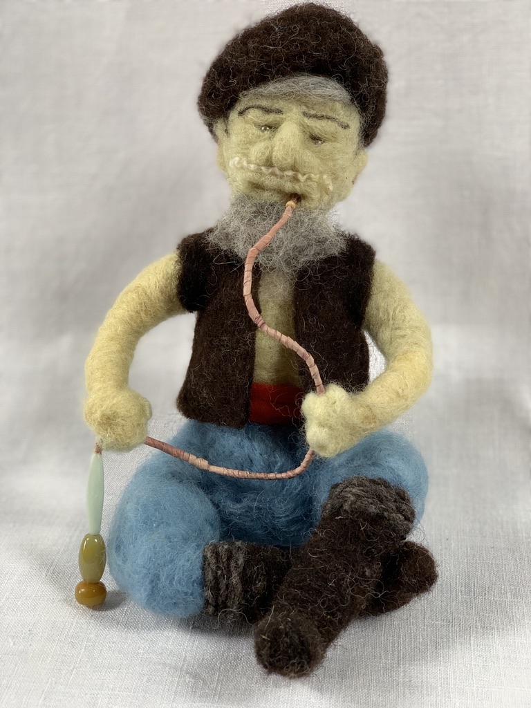 Needle-felted gentleman smoking his nargila.
